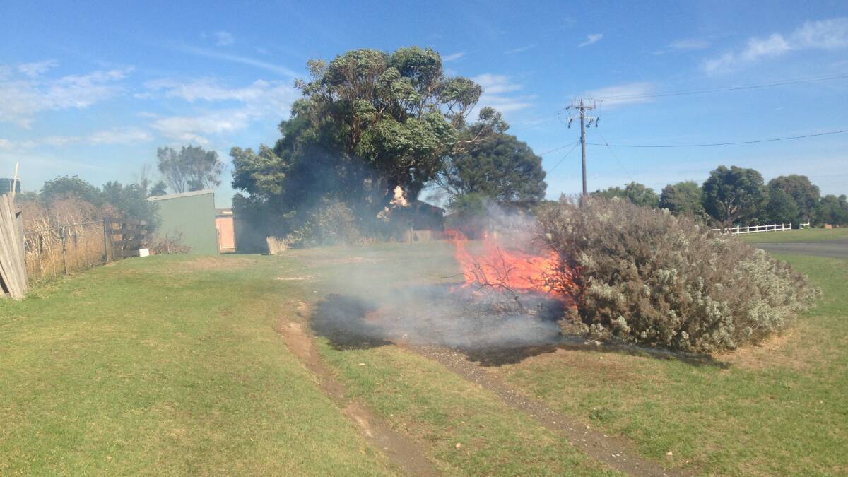 Motorists spotted two-metre high flames, pulling to the side of the highway and alerting the unaware owner behind the house.  