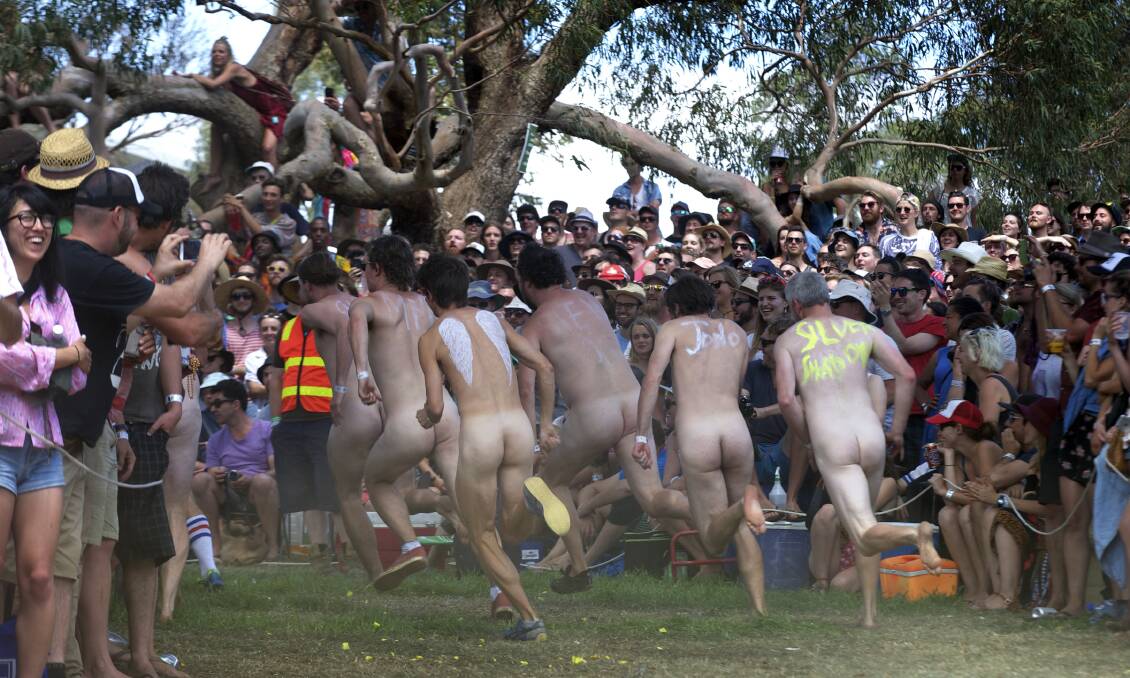 Male competitors battle it out in the annual Meredith nudie run. Photo: Simon O'Dwyer. 