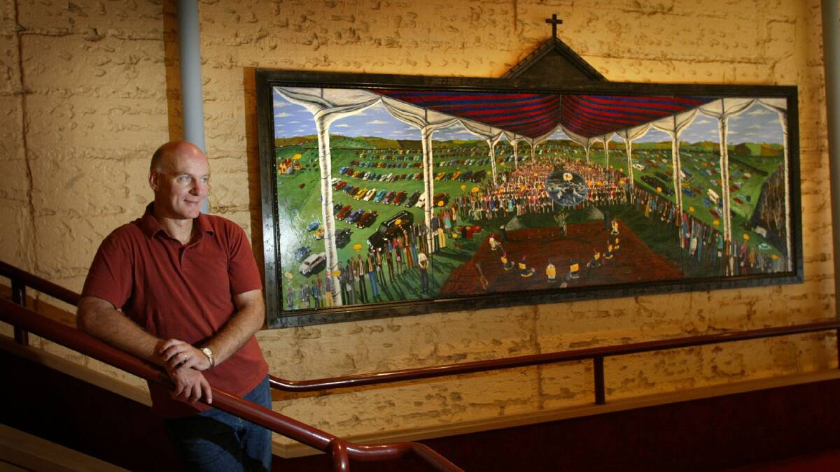 Warrnambool artist Glenn Morgan with his painting of Banjo Clarke, on display in the PAC upstairs foyer.