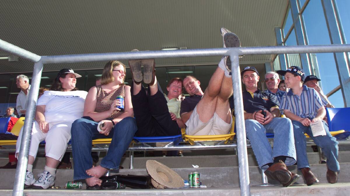 Carmel Waight, Michelle Burnett, Maureen Burnett, Shane Waight, Greg Moy and son Nathan Moy, 9, all from Ballarat, pictured relaxing at the new outdoors grandstand in 2000.
