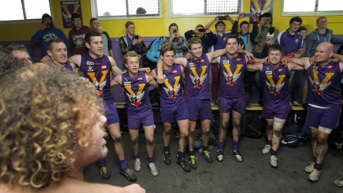 Port Fairy players sing the club song for the first time in two years. Picture: ROB GUNSTONE