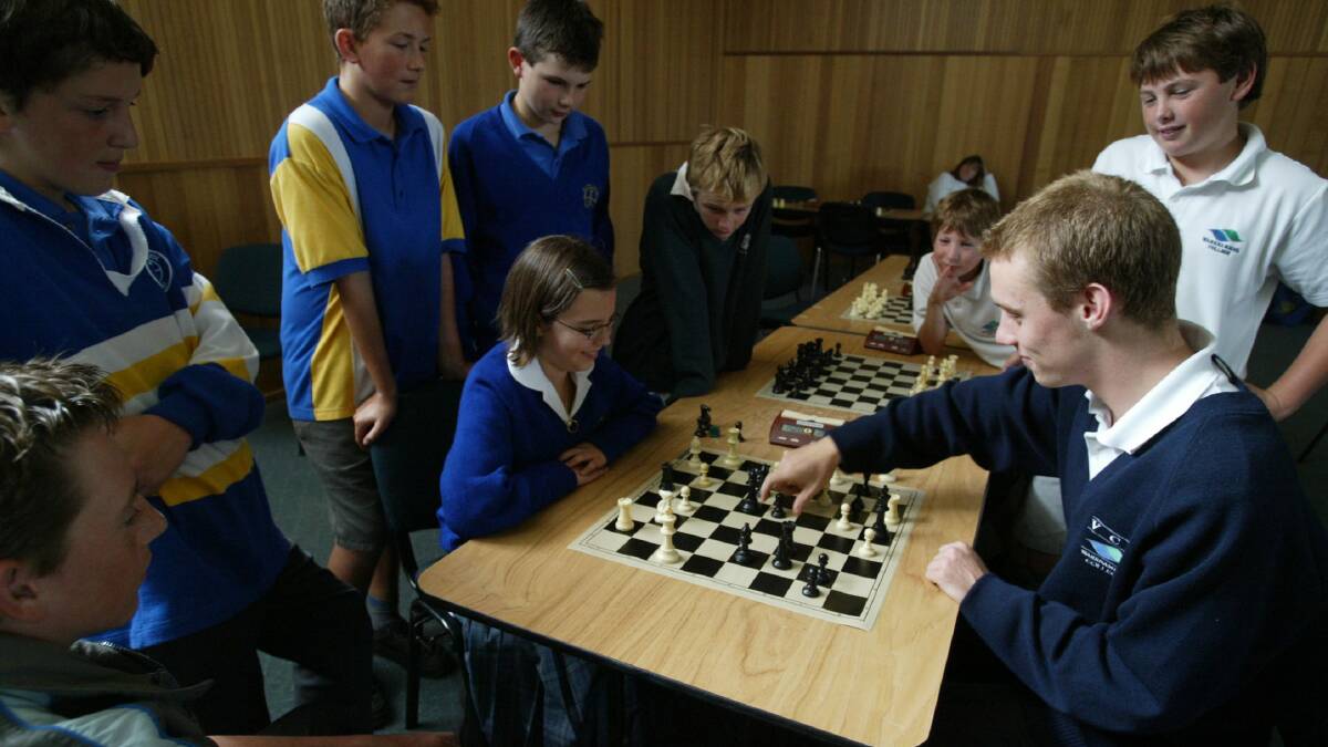Megan Jones, 12, from Bayview College in Portland and Simon Feros, 16, from Warrnambool College playing a practice match of chess at Warrnambool College. 