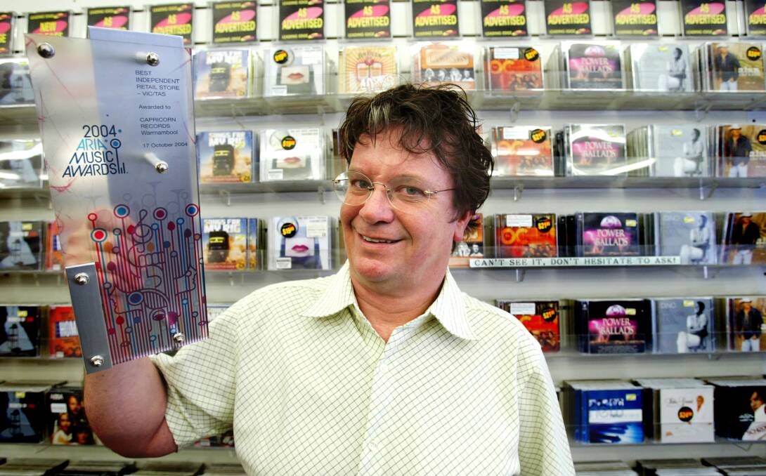 Capricorn Records owner Michael Fitzgerald holding his 2004 Aria Music Award for Best Independant Retail Store. 