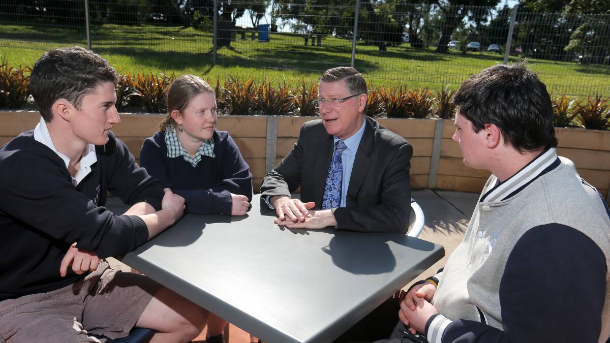 Portland Secondary College students Jack Gibbons (left), 17, Molly Dixon, 17, and Bobby Hodgetts, 17, get an opportunity to ask questions of Premier Denis Napthine during a visit to the school.