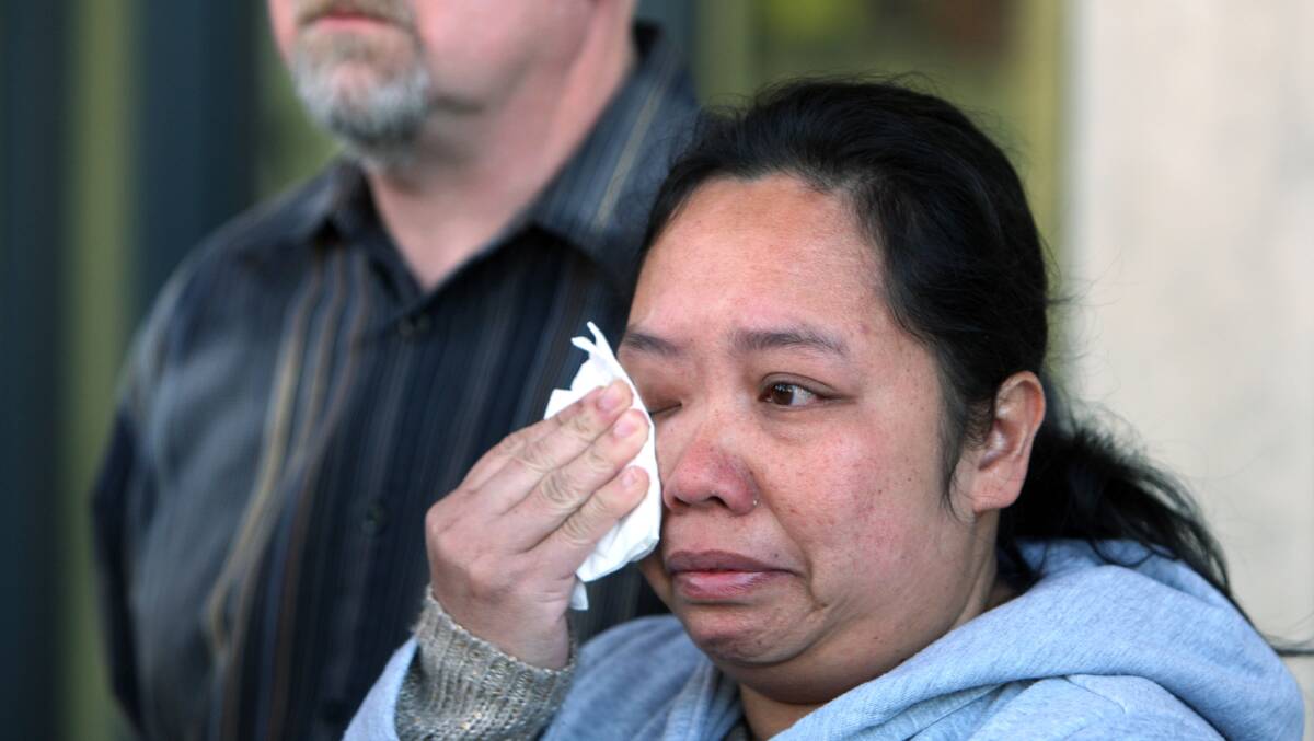 Warrnambool woman Anabel Burn wipes away tears after making an appeal for her missing husband Michael Burn to come home. 