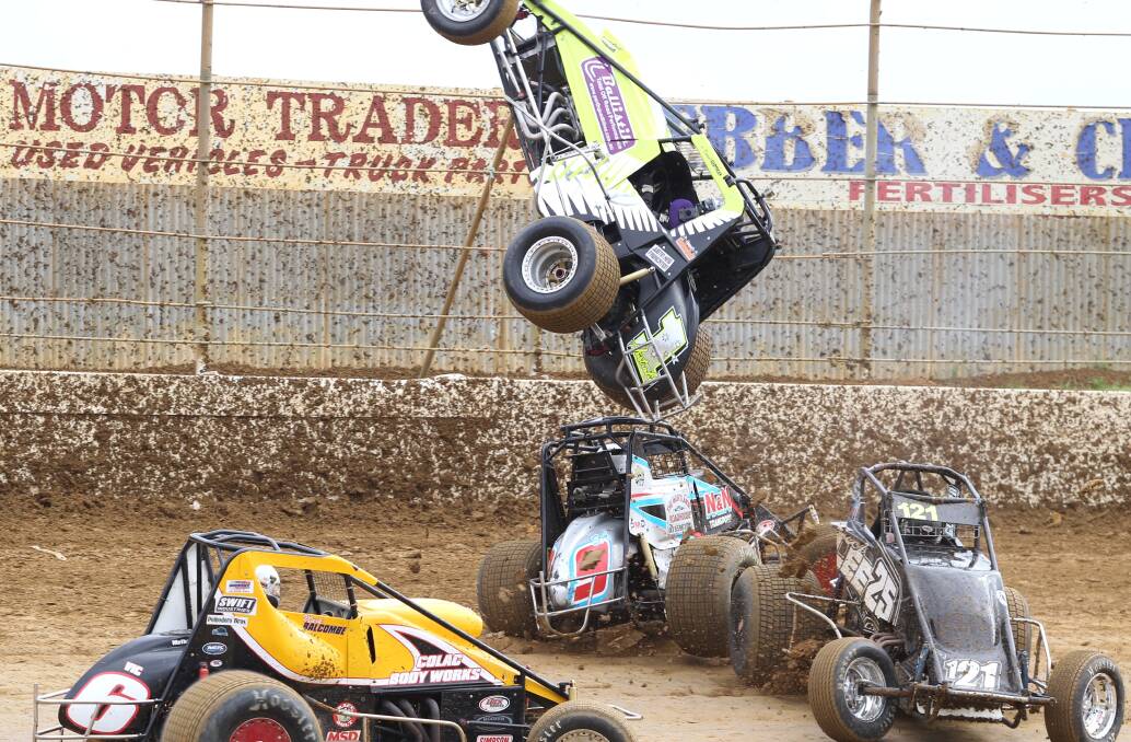 Western Australia-based New Zealander Daniel Hartigan gets some major air after flipping over a three-car crash at the wingless sprints Victorian title at Premier Speedway.