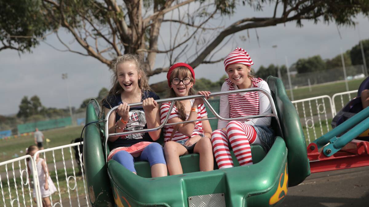 Angelina Mentha, 12, Eloise Pallas, 11, and Katelyn Grant, 12, all from Warrnambool, enjoy a ride.
