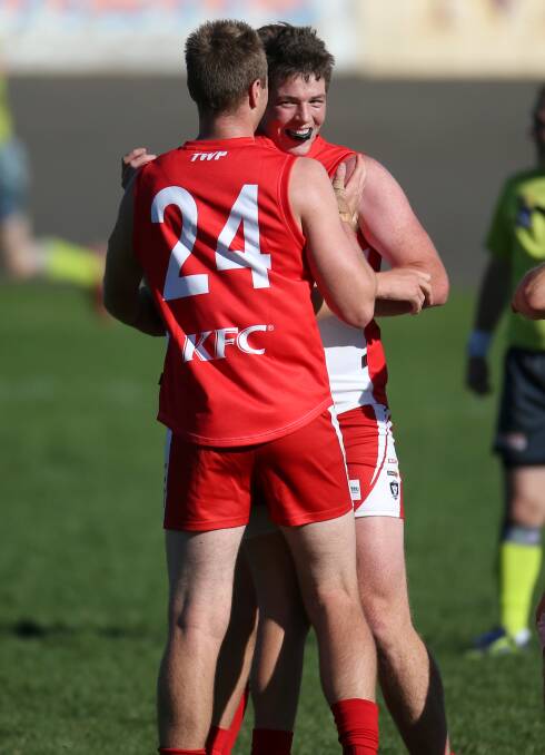 ECSTATIC: South Warrnambool players Travis Parsons and Tom Wilson celebrate a goal in Saturday's thrilling win over Cobden. Picture: Amy Paton