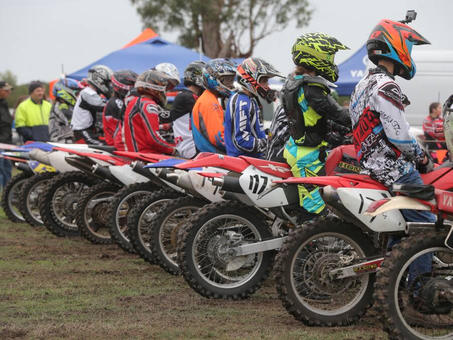READY: Riders line up at the start of a race during the interschool grasstrack competition.