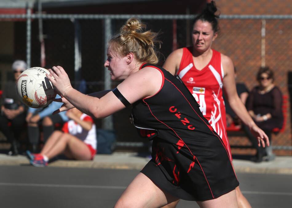 SWIFT MOVES: Cobden coach Nadine McNamara receives the ball during Saturday's convincing win over South Warrnambool. Picture: Amy Paton