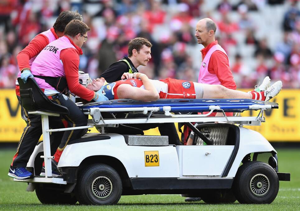 INJURED: Gary Rohan is stretchered from the MCG on Saturday. Picture: Getty Images