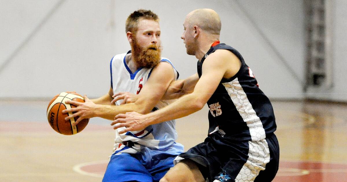 FOCUSED: Terang Tornadoes' Pat Keane tries to evade Horsham Hornets' Brett Goodgame during their clash in round one. Picture: Wimmera Mail-Times