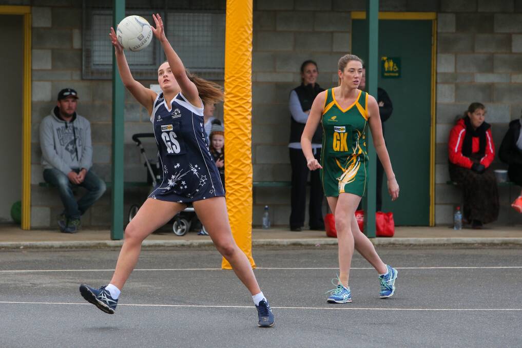 FULL STRETCH: Nirranda goal shooter Sophie Adams takes the ball outside the circle against Old Collegians at Davidson Oval.