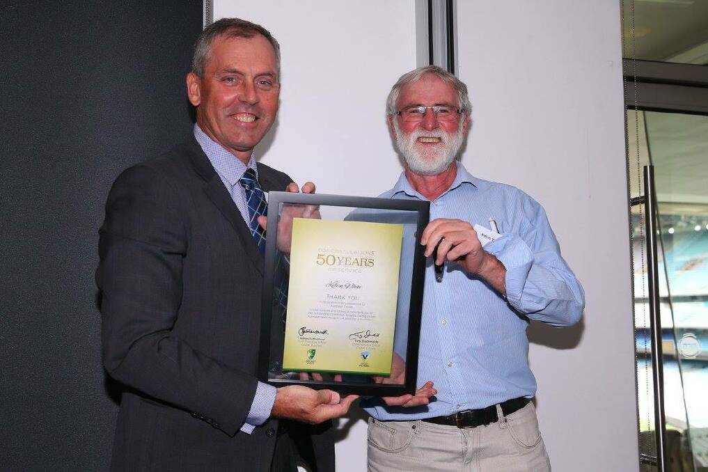 Recognised: Kelvin White is presented with his 50 Years' Service Award. Picture: Cricket Victoria