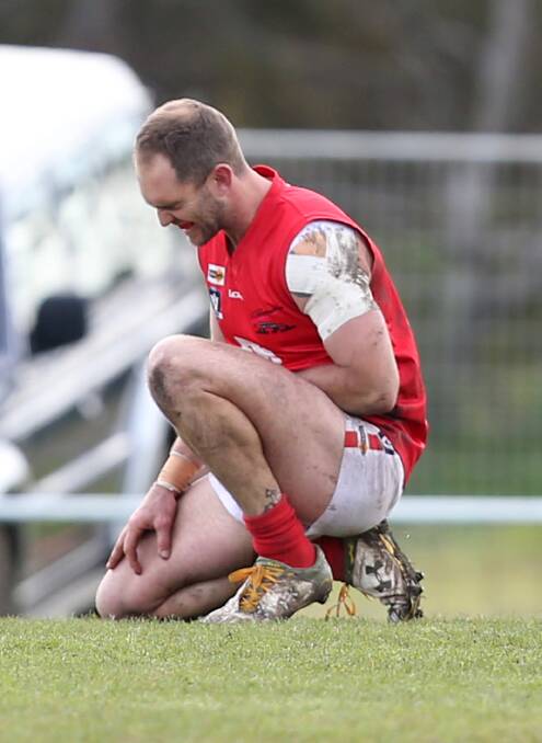 OUCH: Dogs coach Darcy Lewis pulled up a little sore after a marking contest.
