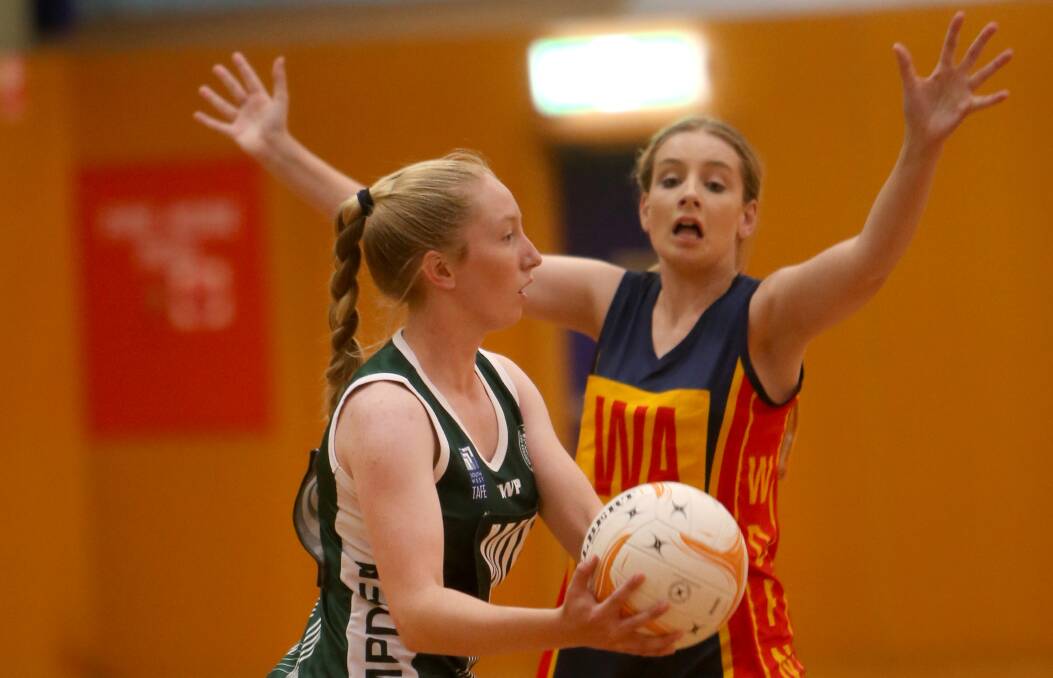 UNDER PRESSURE: WDFNL wing attack Keehna Richards blocks Hampden Green wing defence Jessica Swarbrick on Thursday night. Picture: Amy Paton