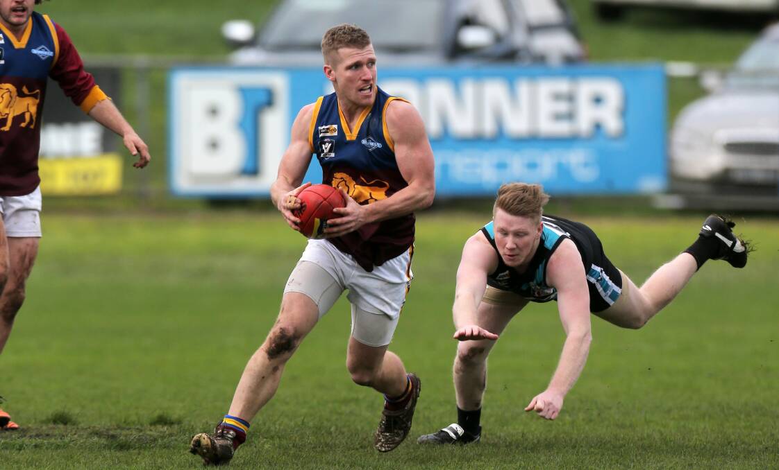 IN WITH A CHANCE: South Rovers vice-captain Braden Hotker breaks away from Kolora-Noorat's Luke Tebble on Saturday. Picture: Rob Gunstone