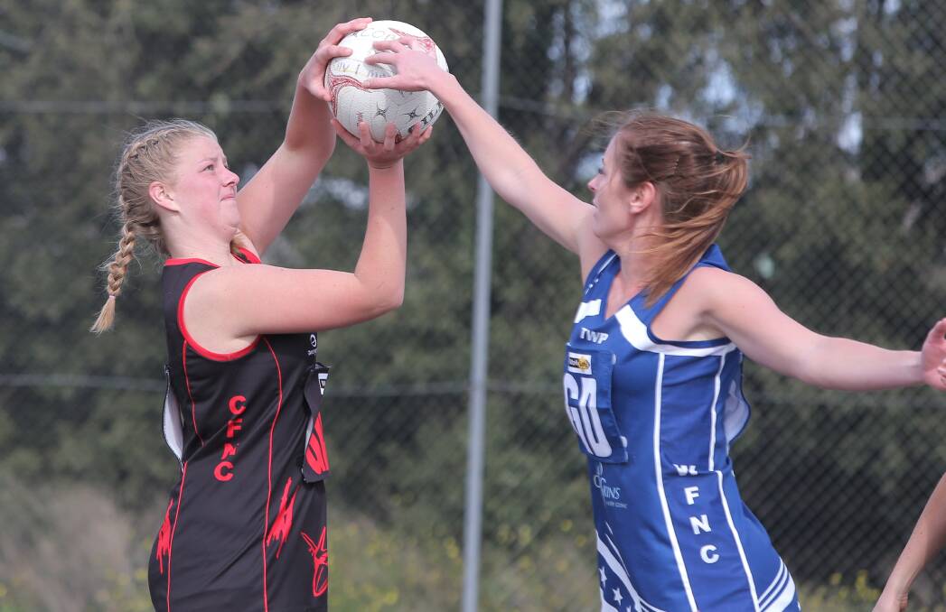 SHOOTING STAR: Promising young Cobden goaler Molly Hutt, pictured playing against Warrnambool's Jenna Graham on the weekend, is excited for her first senior final.