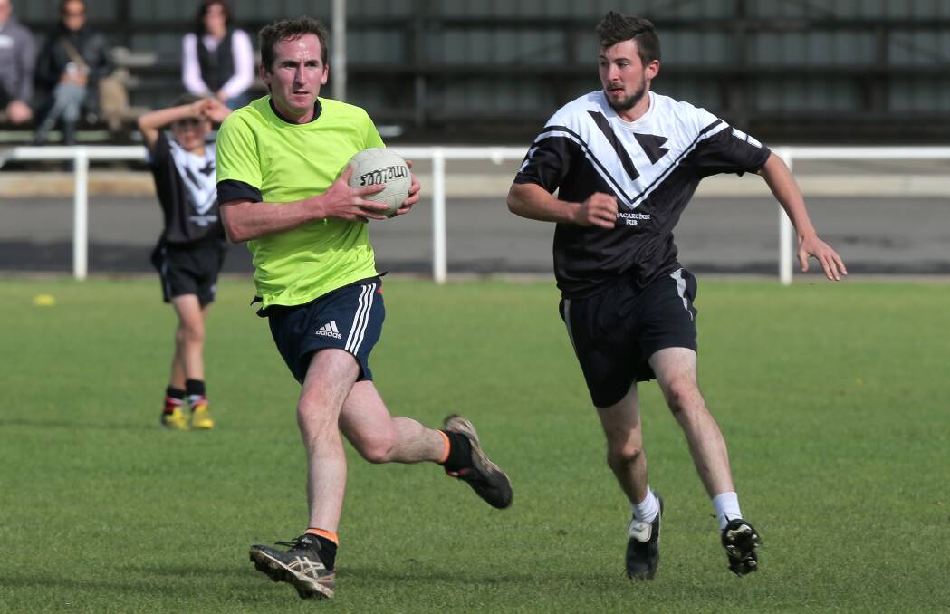 HAVING A BALL: Gerald Conway (left) and Donal Keown during this year's Koroit Irish Festival Gaelic Football tournament. Picture: Rob Gunstone