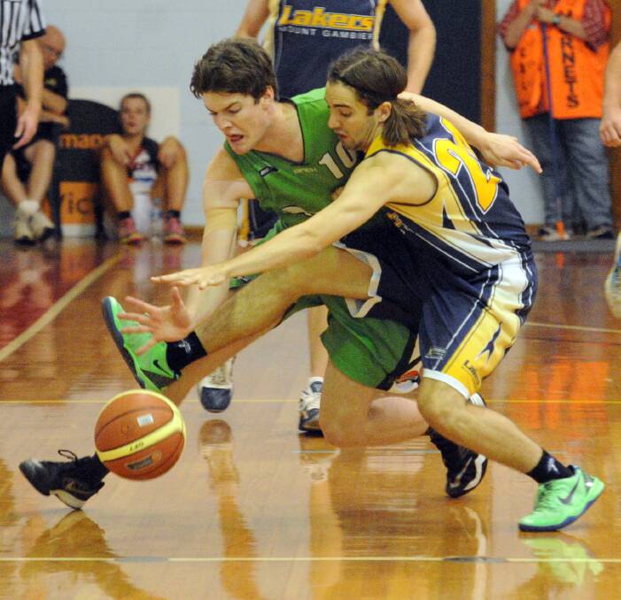 CONTEST: Warrnambool's Sam Gray battles Mount Gambier's Joshua Jenner for the ball in Saturday's Country Basketball League south west conference final. Picture: Paul Carracher, Wimmera Mail-Times.