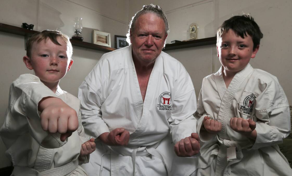 POWER UP: Mortlake's Arlo Herry, 6, his grandfather Paul, 64, and brother Cooper, 8, are all learning the ropes of karate together. Picture: Rob Gunstone