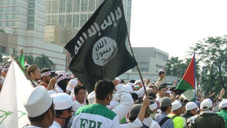 Members of FPI, the Islam Defenders Front, take to the streets in Jakarta. Photo: Michael Bachelard