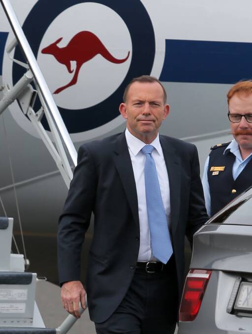 TOUCHDOWN: Prime Minister Tony Abbott arrives at Hamilton Airport on Friday afternoon. Picture: Rob Gunstone
