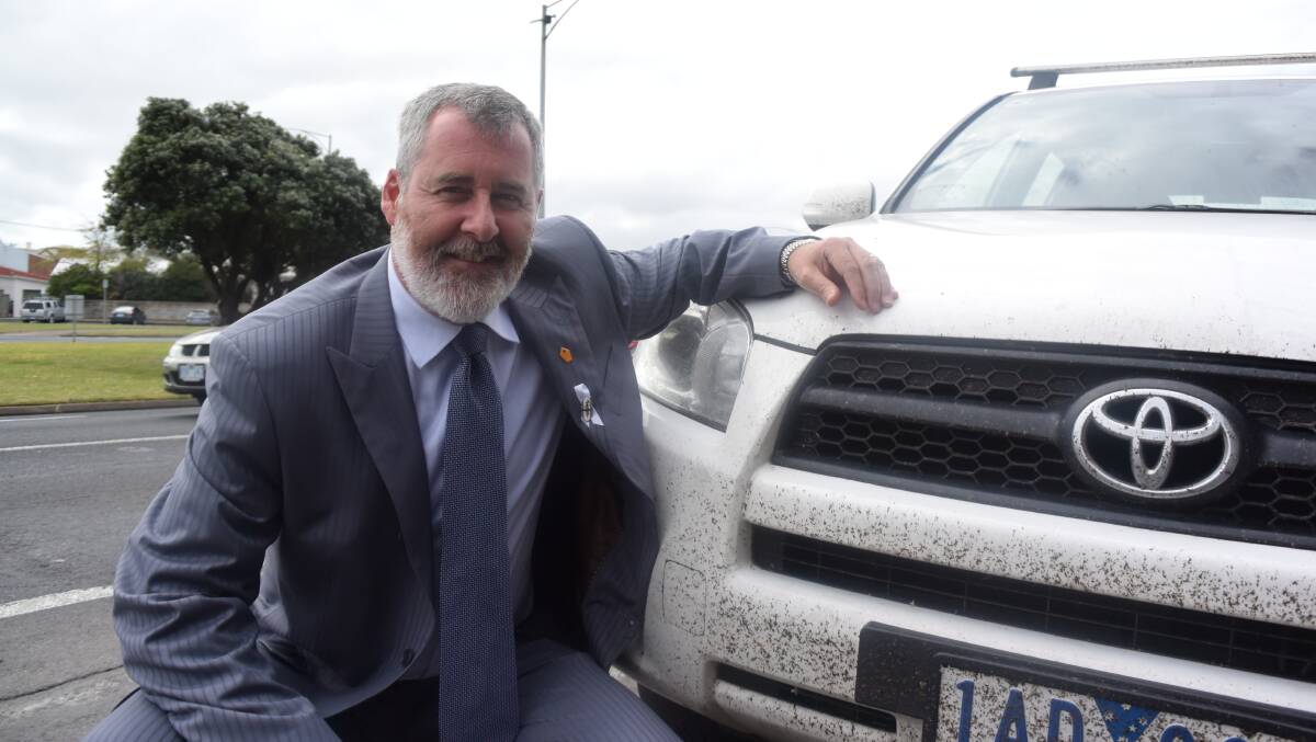 South West Coast independent candidate Roy Reekie with his vehicle on Raglan Parade on Tuesday morning.