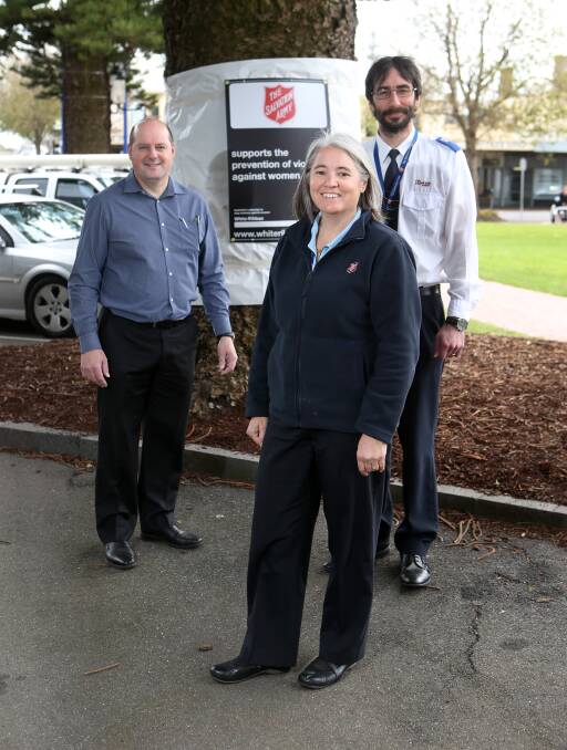 ON BOARD: Lindsay Stow from SalvoConnect with Karina Wood and Chris Philpot from Salvation Army Warrnambool in front of their tree wrapping. Picture: Amy Paton