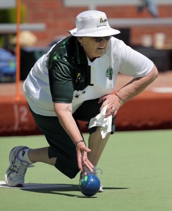 BENDING HER BACK: City Memorial Green's Betty Hirst gets into her work during the Tuesday pennant clash against Warrnambool Blue. Picture: Rob Gunstone

