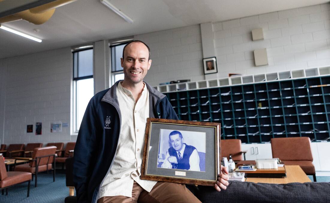 Warrnambool College principal David Clift is getting ready for a 30 year celebration for the school. He has a photo of former principal Ray Welsford. Picture by Anthony Brady