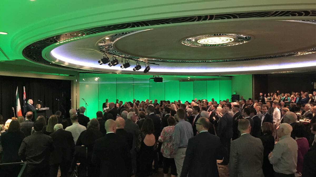 SHADES OF GREEN: Part of the big crowd at the Melbourne reception at the Grand Hyatt in Melbourne last Friday listening to Irish president Michael D. Higgins. 