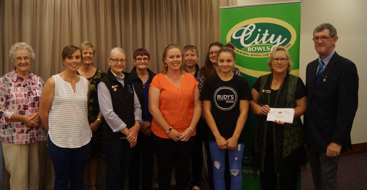 HAPPY: City Memorial Bowls Club board chairman Gerald Madden (far right) with representatives from some of the groups that have benefited from the Lucky Seven Community Bingo.  