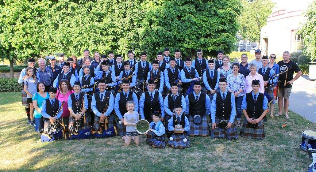 ON TOUR: The Warrnambool Pipe Band and their support crew during a successful trip to New Zealand last weekend.