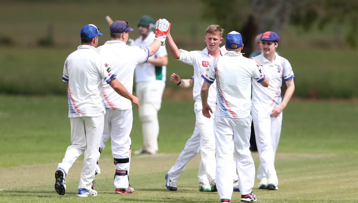 HE'S OUT: Terang bowler Brandon Bant high fives wicketkeeper Liam Venn after claiming the first wicket of the Bookaar innings. Picture: Amy Paton