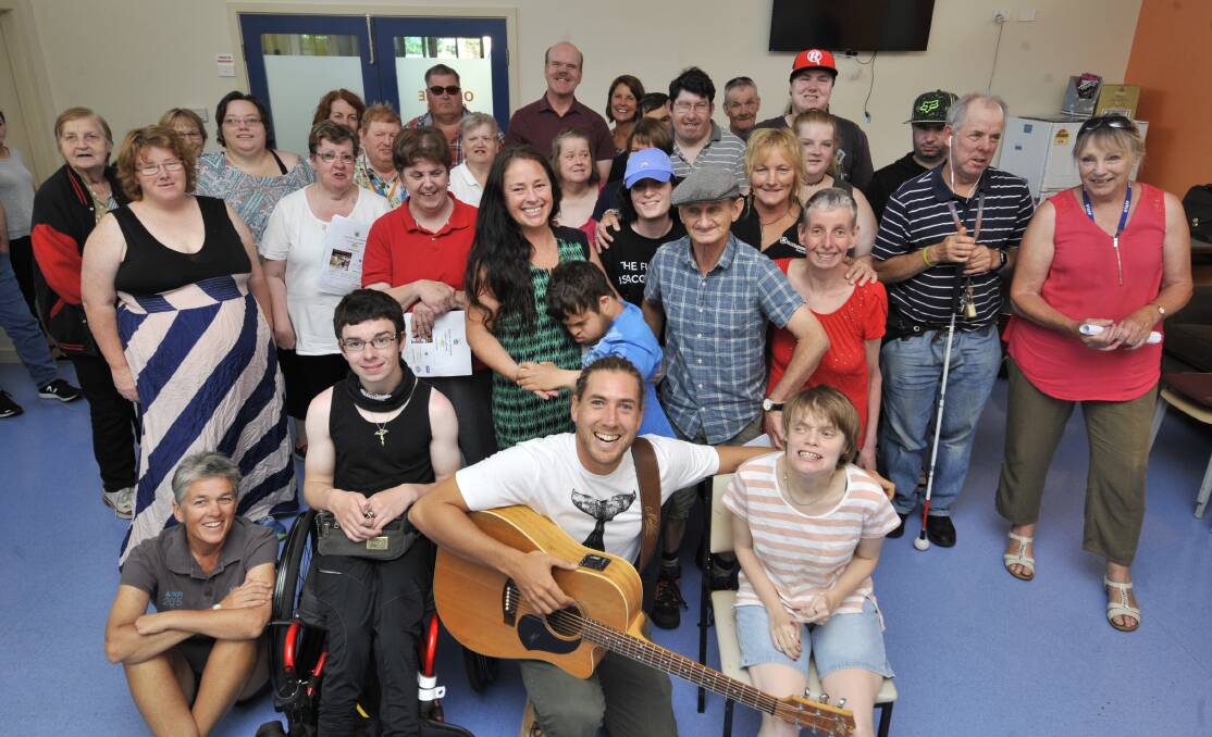 TOGETHER: Warrnambool musican Tom Richardson and members of the Find Your Voice all-abilities choir. Picture: Hamilton Spectator
