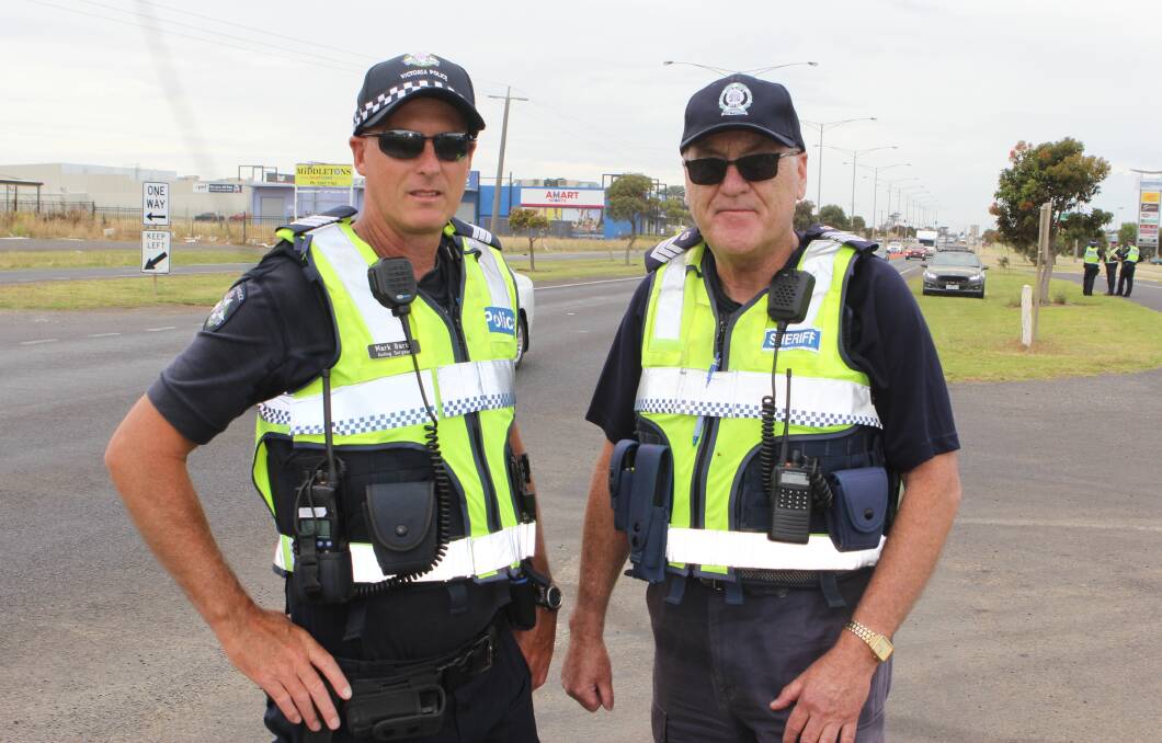 DOUBLE UP: Acting Sergeant Mark Barby from Warrnambool police and sheriff officer Sergeant Tony Hochreiter and their teams have joined forces. Picture: Anthony Brady   
