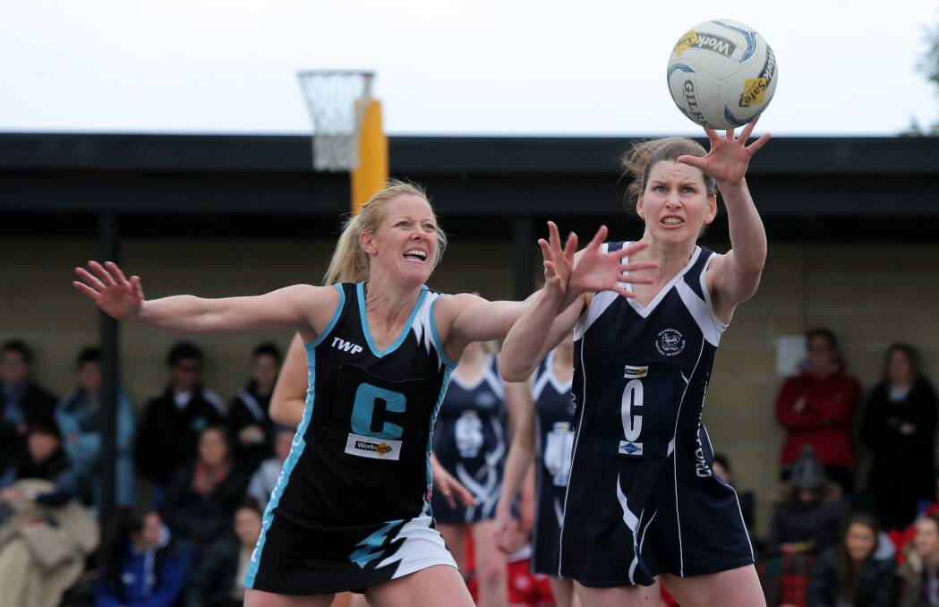 FINGER TIP TOUCH: Allansford centre Liz Byrne has the ball under her spell as Kolora-Noorat's Faye Clarke moves in to apply some pressure. Picture: Rob Gunstone

