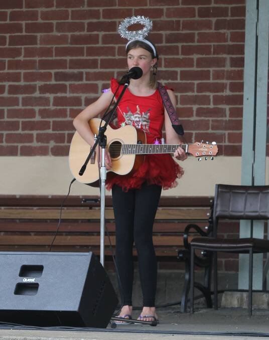 ENTERTAINING: Koroit's Monique Brown performs at the Koroit Carols by the Railway event on Sunday.