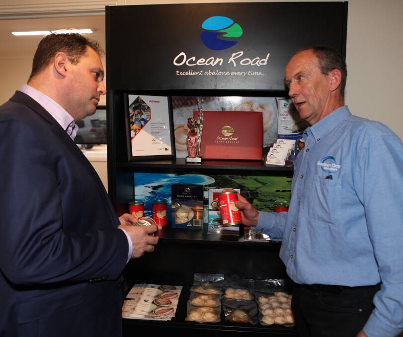 WHAT'S ON OFFER: Southern Ocean Mariculture's Mark Gervis (right) talks to Philip Dalidakis about some of the product from the Port Fairy operation. Picture: Anthony Brady