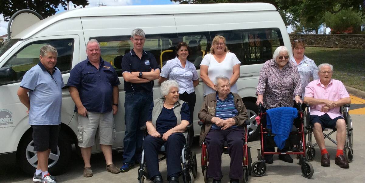 ON THE ROAD: Residents, staff and volunteer drivers in front of the Mount View Aged Care Facility bus. The bus has been well used since it was purchased at the beginning of last year. 