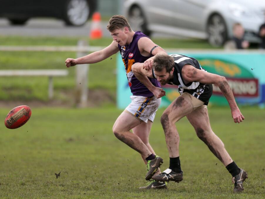 THE RACE IS ON: Port Fairy's Herbertson and Camperdown's Daniel Seehusen chase down a loose ball during the game at Leura Oval. Picture: Rob Gunstone