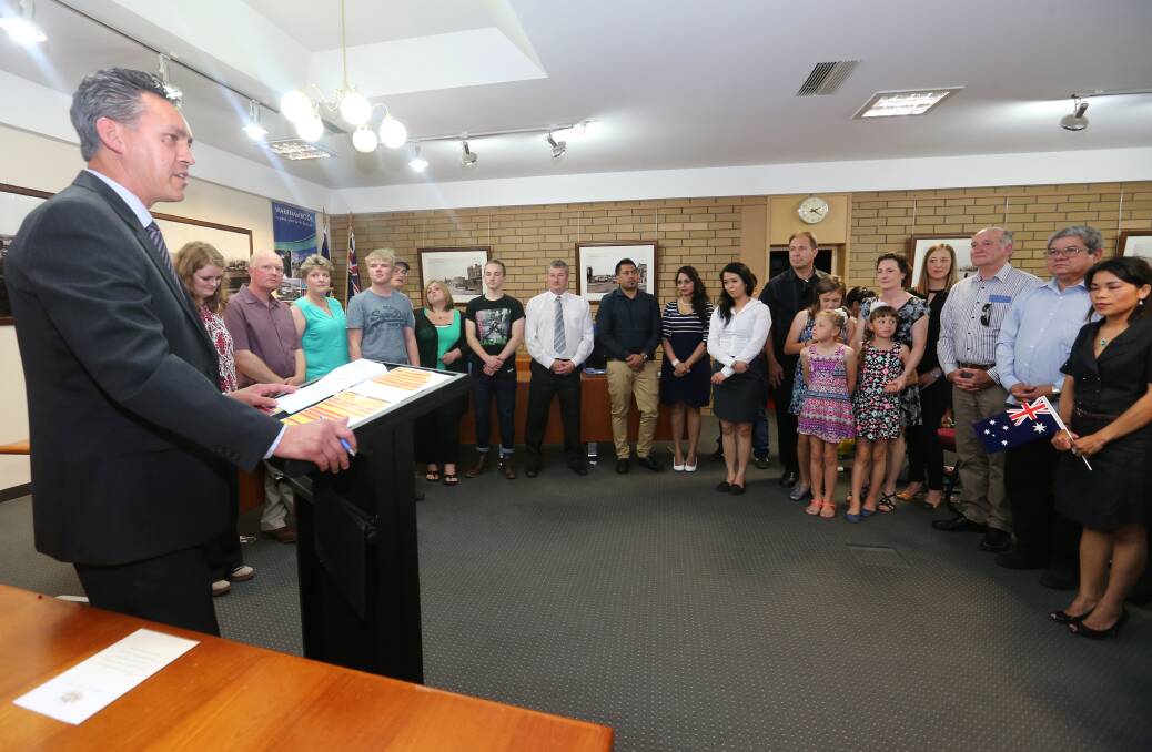 WELCOME: Warrnambool Mayor Michael Neoh addresses a group of 28 people who became Australian citizens on Wednesday afternoon. Picture: Amy Paton  
