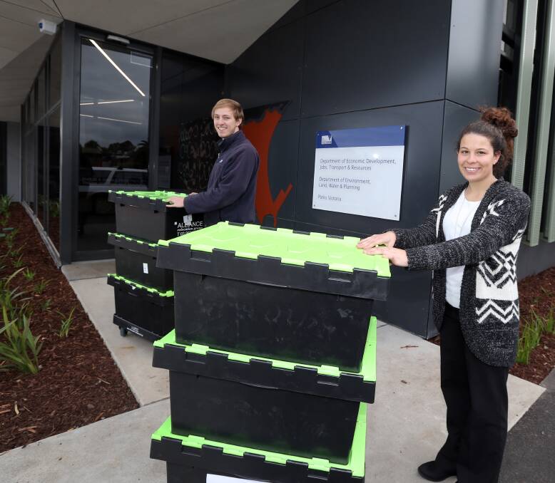 MOVING IN: Matt Reynolds and Emilee Bezzina move into the new $8.25-million state government offices on Raglan Parade, which replace the former offices on Henna Street. Picture: Damian White