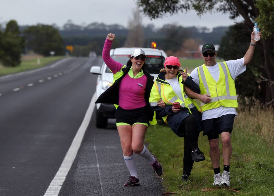 STEPPING UP: Kate Meade and Graham Sealey join Gail Jaensch (centre) on the trek down the Princes Highway. Picture: DAMIAN WHITE