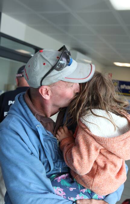 SEE YOU SOON: Toolong's Leigh Dwyer kisses daughter Bel, 4, goodbye before flying to South Australia to help with the ongoing bushfire crisis. Picture: Jarrod Woolley