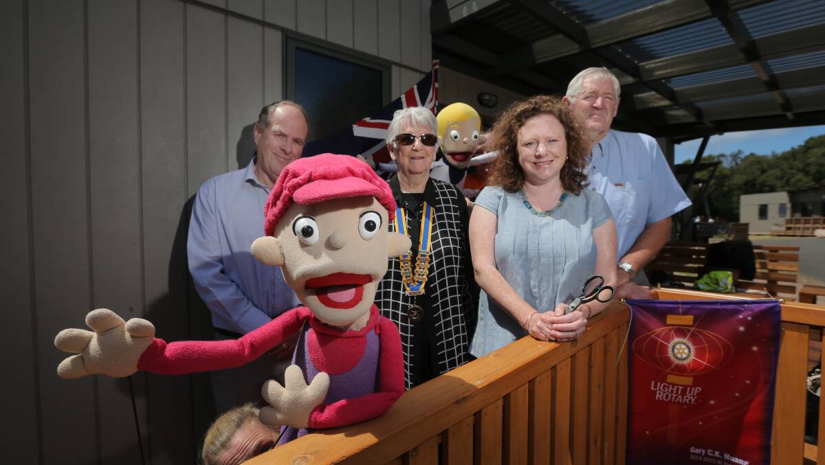 Richard Hawker, Marie Bennett, councillor Kylie Gaston and Kylie the Puppet from Camp Quality at the opening of the new cabin in 2014. 