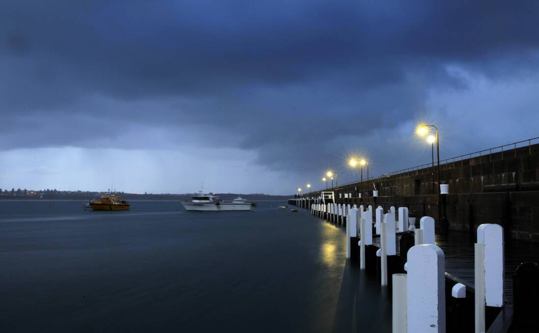 Storm clouds over the Breakwater and Lady Bay.