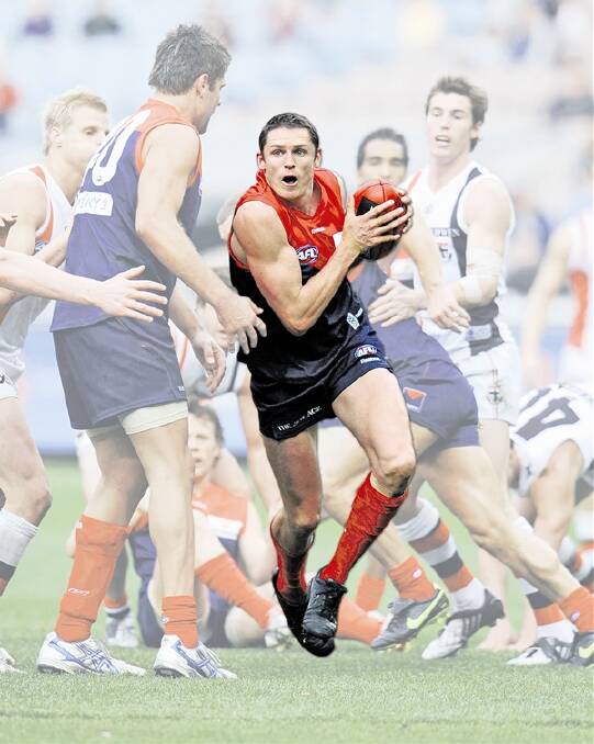 Paul Wheatley, centre, on the burst for Melbourne in 2009.