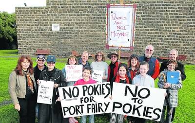 Port Fairy residents  take a public stance about their anti-pokies feelings at a protest rally on the town's Village Green.